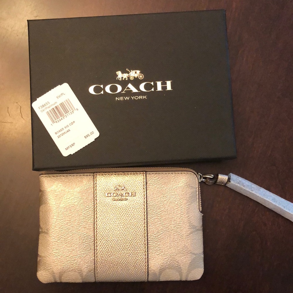 Gold coach wristlet